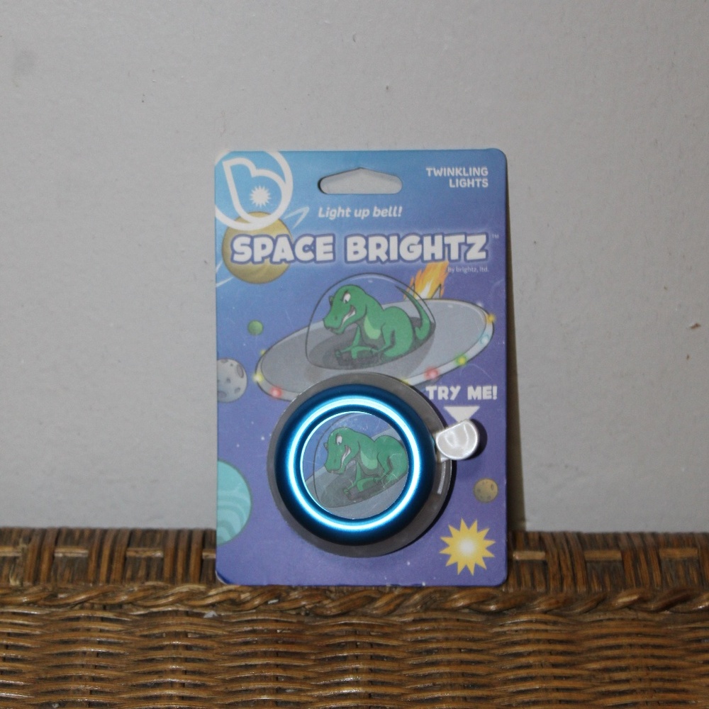 Space Brightz.  Dinosaur. Light Up Bell.  Twinkling Lights.